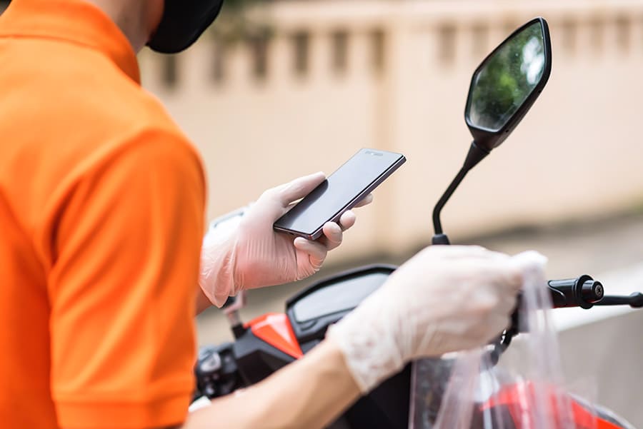 deliveryman check customer location by smartphone during covid191